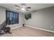 Home gym with stationary bike and wall-mounted TV at 1320 Moss Creek Ln, Davenport, FL 33836
