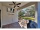 Covered patio with brick flooring, outdoor furniture, and a view of the backyard at 1320 Moss Creek Ln, Davenport, FL 33836