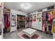 Large walk-in closet with ample shelving and drawers at 1320 Moss Creek Ln, Davenport, FL 33836