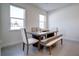 Dining room with wood table, bench, and window light at 1765 Petiole Pl, Kissimmee, FL 34744