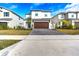 Two-story house with brown garage door and paver driveway at 1765 Petiole Pl, Kissimmee, FL 34744