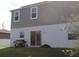 Rear view of house with grilling area at 196 Albany Dr, Kissimmee, FL 34759