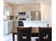 Eat-in kitchen with stainless steel appliances and an island at 196 Albany Dr, Kissimmee, FL 34759