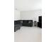 Comfortable living room featuring tiled floors and a cozy, dark-colored sectional sofa at 196 Albany Dr, Kissimmee, FL 34759