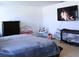 Main bedroom with king-size bed, dresser, and crib at 196 Albany Dr, Kissimmee, FL 34759