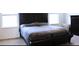 Large bedroom with a king-size bed and dark brown headboard at 196 Albany Dr, Kissimmee, FL 34759