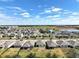 Aerial view of community with lake and homes at 2124 Live Oak Lake Rd, St Cloud, FL 34771