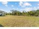 Large backyard with grassy area and partial privacy at 2124 Live Oak Lake Rd, St Cloud, FL 34771