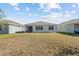 Home's rear elevation, spacious backyard at 2124 Live Oak Lake Rd, St Cloud, FL 34771