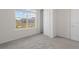 Bright bedroom with grey carpet, large window, and walk-in closet at 2124 Live Oak Lake Rd, St Cloud, FL 34771