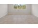 Spacious bedroom with tile floors and a large window at 2124 Live Oak Lake Rd, St Cloud, FL 34771