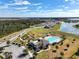 Community pool, playground, and clubhouse with parking area at 2124 Live Oak Lake Rd, St Cloud, FL 34771