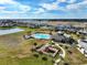 Aerial view of community pool, playground, and surrounding homes at 2124 Live Oak Lake Rd, St Cloud, FL 34771