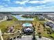 Aerial view of community pool, playground, and surrounding homes at 2124 Live Oak Lake Rd, St Cloud, FL 34771