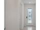 Bright entryway with tile flooring and a door with stained glass at 2124 Live Oak Lake Rd, St Cloud, FL 34771