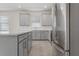 Modern kitchen with gray cabinets, stainless steel appliances, and an island at 2124 Live Oak Lake Rd, St Cloud, FL 34771
