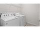 Laundry room with washer, dryer, and utility sink at 2124 Live Oak Lake Rd, St Cloud, FL 34771