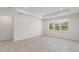 Bright living room with tile floors and large windows at 2124 Live Oak Lake Rd, St Cloud, FL 34771