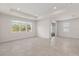 Bright and airy living room with tile floors and a view to the outside at 2124 Live Oak Lake Rd, St Cloud, FL 34771