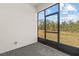 Screened patio with paver floor and backyard view at 2124 Live Oak Lake Rd, St Cloud, FL 34771