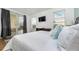 Comfortable bedroom with sliding glass doors leading to the patio at 2243 Wyndham Palms Way, Kissimmee, FL 34747
