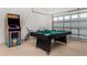 Game room features pool table, arcade game, and bicycles at 2243 Wyndham Palms Way, Kissimmee, FL 34747