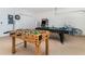 Game room with foosball table, pool table, and bicycle at 2243 Wyndham Palms Way, Kissimmee, FL 34747