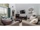 Spacious living room featuring comfortable seating and a large TV at 2243 Wyndham Palms Way, Kissimmee, FL 34747