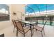Outdoor patio with table and chairs, overlooking the pool at 2243 Wyndham Palms Way, Kissimmee, FL 34747