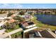 Aerial view of house with solar panels and pool, near lake at 2302 Aberdeen Ct, Kissimmee, FL 34743