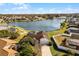 Aerial view of house near lake with pool and large backyard at 2302 Aberdeen Ct, Kissimmee, FL 34743