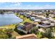 Aerial view showing house's backyard, pool, and lakefront location at 2302 Aberdeen Ct, Kissimmee, FL 34743