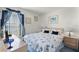 Guest bedroom with seashell bedding and window view at 2302 Aberdeen Ct, Kissimmee, FL 34743
