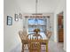 Dining area with lake view and sliding doors to screened patio at 2302 Aberdeen Ct, Kissimmee, FL 34743