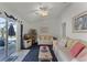 Living room with comfy seating and sliding doors leading to pool at 2302 Aberdeen Ct, Kissimmee, FL 34743