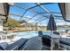 Relaxing screened pool area with lake view at 2302 Aberdeen Ct, Kissimmee, FL 34743