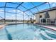 Refreshing screened pool with lake view at 2302 Aberdeen Ct, Kissimmee, FL 34743