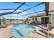 Inviting kidney shaped pool with patio furniture at 2302 Aberdeen Ct, Kissimmee, FL 34743