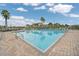 Community pool with plenty of lounge chairs at 2404 Huron Cir, Kissimmee, FL 34746