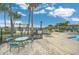 Relaxing pool area with tables, chairs, and lake views at 2404 Huron Cir, Kissimmee, FL 34746