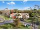 Condo building with ample parking and surrounding trees at 2452 Sweetwater Club Cir # 27, Kissimmee, FL 34746