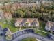 Aerial view showcasing building location and parking at 2452 Sweetwater Club Cir # 27, Kissimmee, FL 34746