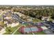 Aerial view of community, including tennis and basketball courts at 2452 Sweetwater Club Cir # 27, Kissimmee, FL 34746