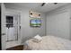 Bedroom with a double bed, TV, and laundry access at 2452 Sweetwater Club Cir # 27, Kissimmee, FL 34746