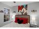 Bright bedroom with a double bed, Mickey Mouse art, and a window at 2452 Sweetwater Club Cir # 27, Kissimmee, FL 34746