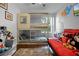 Bedroom with bunk beds, red couch, and Mickey Mouse decor at 2452 Sweetwater Club Cir # 27, Kissimmee, FL 34746