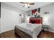 Bedroom with double bed, Mickey Mouse decor, and ample closet space at 2452 Sweetwater Club Cir # 27, Kissimmee, FL 34746