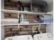 Clean laundry room with stacked washer and dryer, and storage at 2452 Sweetwater Club Cir # 27, Kissimmee, FL 34746