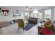 Living room with gray sofas, green chair, and large TV at 2452 Sweetwater Club Cir # 27, Kissimmee, FL 34746