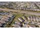 Aerial view showing neighborhood homes, streets, and landscape at 250 Pendant Ct, Kissimmee, FL 34747